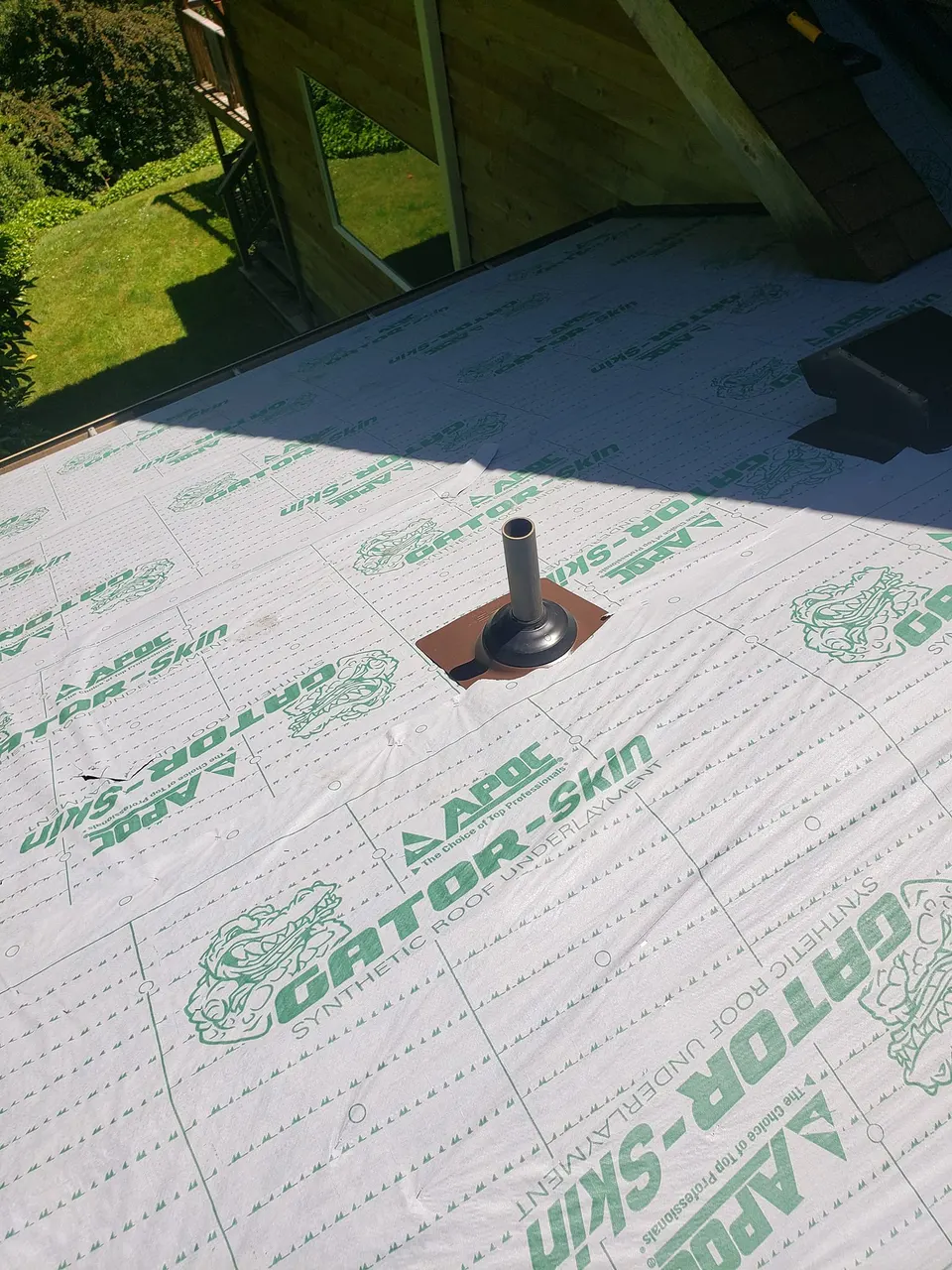 APOC Gator-Skin underlayment installed on roof deck during replacement in Tacoma
