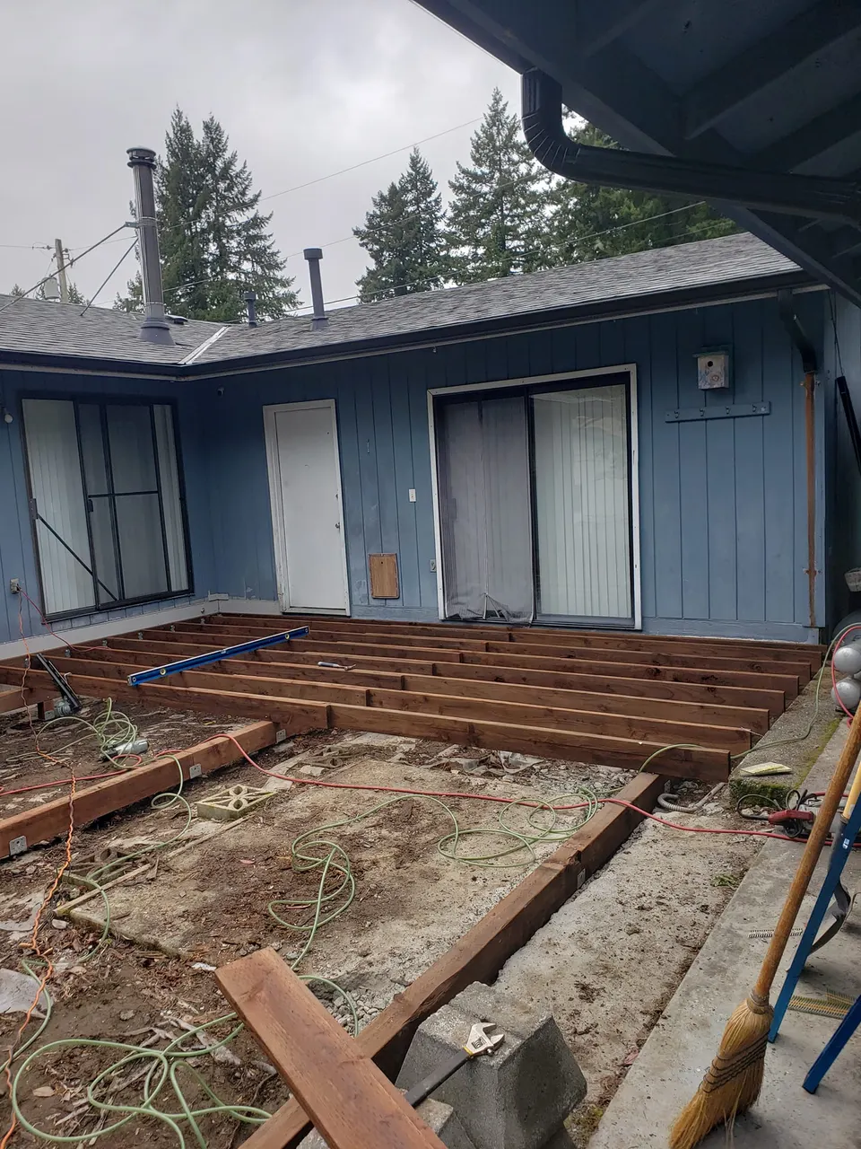 Deck frame viewed from back of house during construction