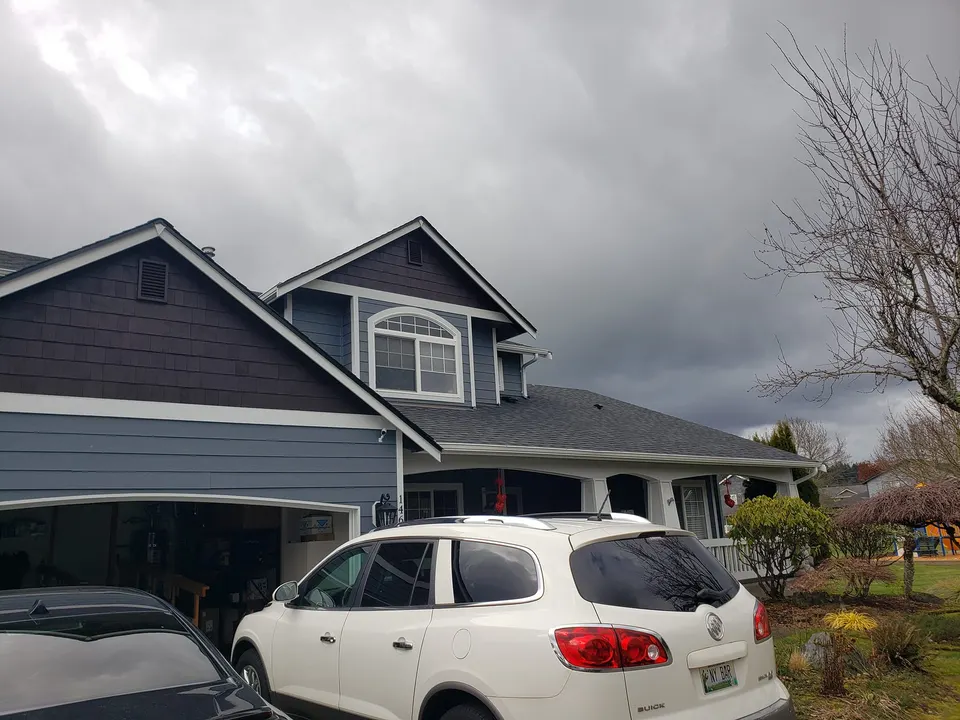 Large two-story home in Tacoma requiring interior and exterior renovation