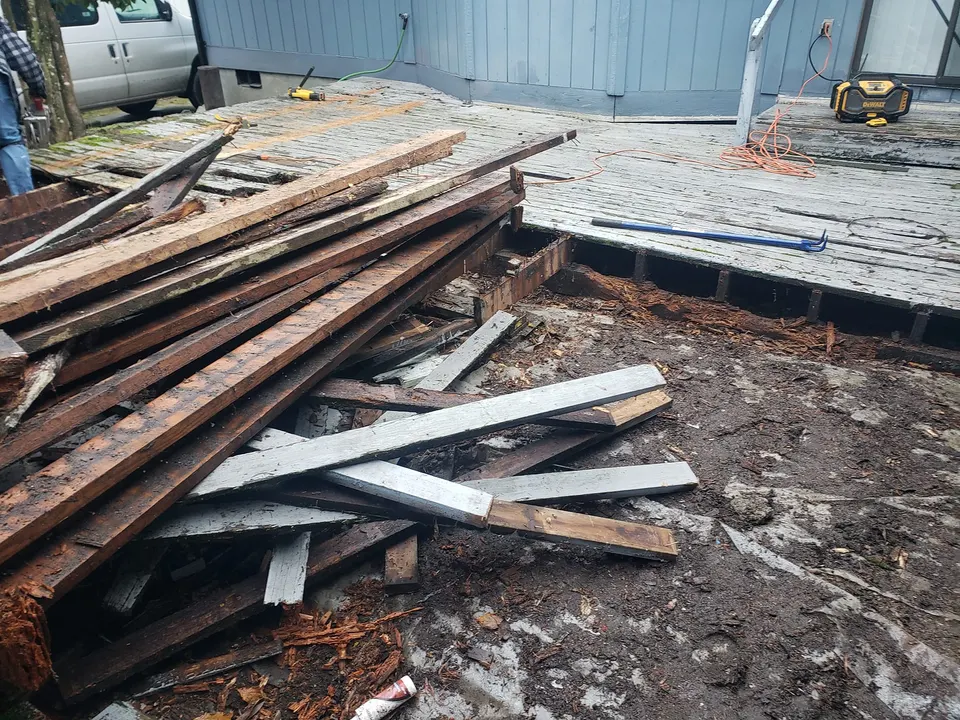 Old rotted deck being demolished for replacement in Tacoma, WA